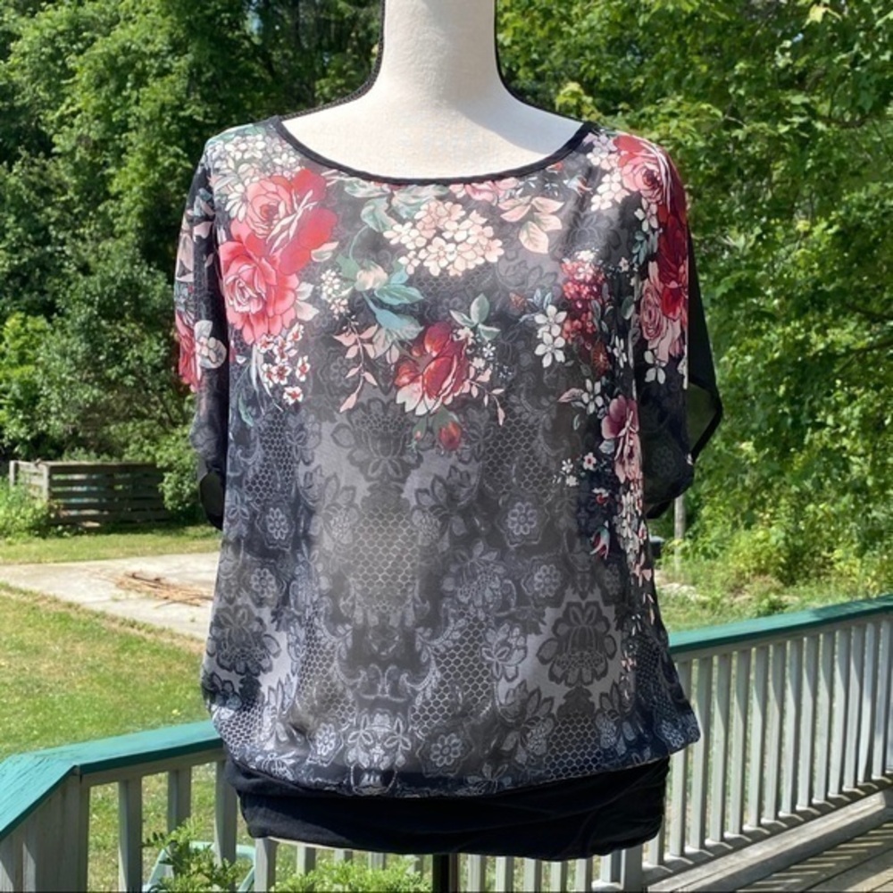 MAURICES black sheer blouse “painted” with beautiful flowers in size Medium. EUC